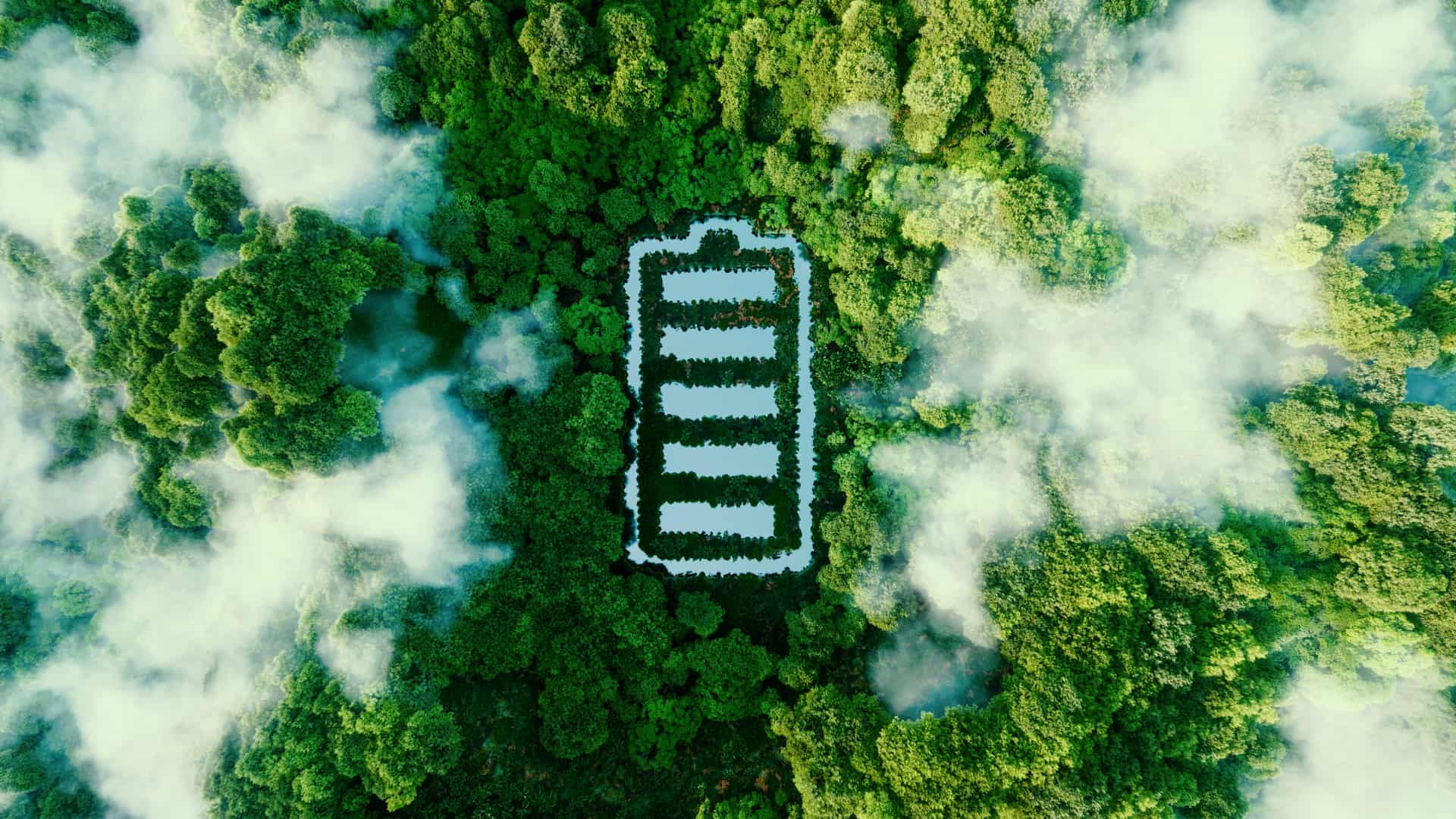 Vista área de un bosque en el que el icono de una batería de móvil cargada, se forma mediante ríos representa la energía verde